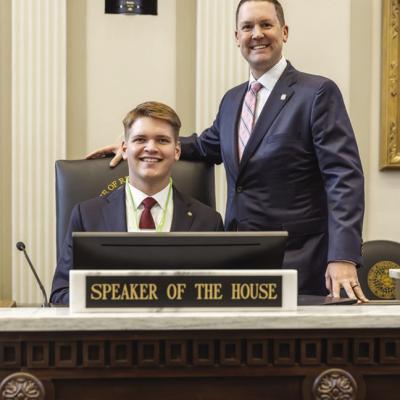 Preston Payne, left, sits at the chair of the Speaker of the House with Speaker Pro Tempore Anthony Moore after returning to page. CDN | Courtesy photo Preston Payne, left, sits at the chair of the Speaker of the House with Speaker Pro Tempore Anthony Moore after returning to page. CDN | Courtesy photo
