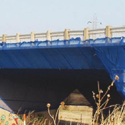 Blue netting covers the I-beams on the Washita River Bridge on the east edge of Clinton on Business I-40. Once removed, the steel I-beams will be given to Custer County commissioners. County to get I-beams from east Washita River Bridge project