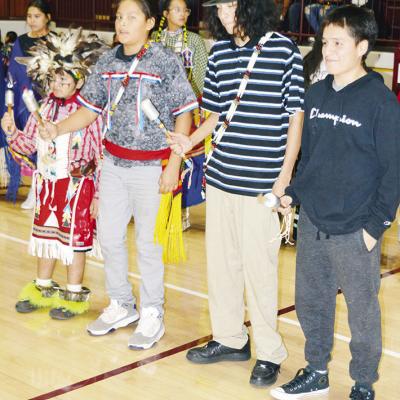 Students from left, Touchcloud Watan, Demars Ellis, Damyn Redshin and A.J. Reynolds perform the Gourd Dance at the recent Native American Showcase at Clinton High School. CDN | Michael Maresh