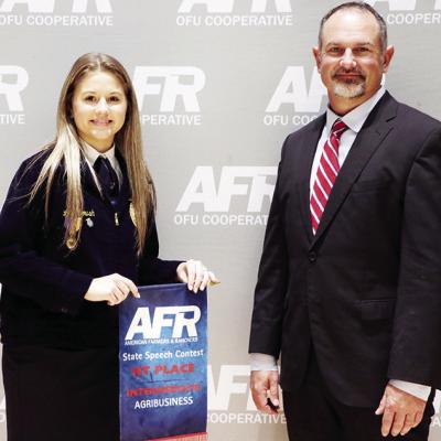 Arapaho-Butler’s Lilly Roush, left, is awarded first place by Vice President Ryan Plemmons after competing in the Intermediate Agribusiness category at the American Farmers and Ranchers (AFR) State Speech Contest recently in Stillwater. CDN | Courtesy p Roush wins first place in statewide speech contest