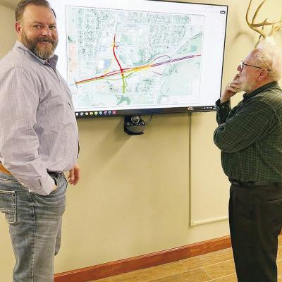 Oklahoma Department of Transportation Dist. 5 Engineer Will Snipes, left, and Clinton City Manager Robert Johnston discuss the updated phases of the upcoming Exit 65 project. CDN | Shiann Dawson