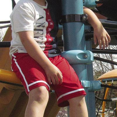 Grayson Wagoner takes a break from climbing at McLain Rogers Park. CDN | Christian Jacobsen