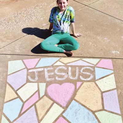 Clinton Middle School seventh-grade art student Kalyssa Staggs practices her skills at home, using sidewalk chalk to create her own Easter message. Social distancing won’t stop Easter