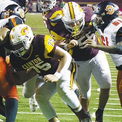 Clinton’s No. 75 Eli Anderson and No. 55 Bryson Snider work to open a hole for a ball carrier to run through in the Red Tornadoes’ home game against Douglass to end the regular season. CDN | Micah Ashcraft