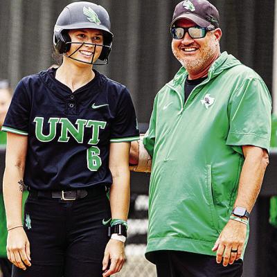 University of North Texas Coach Jon Hunter, right, chats with Elizabeth Moffitt during a game. UNT Athletics