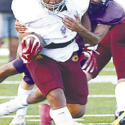 Clinton’s Malachi Lorne shrugs off a defender during the Red Tornadoes’ scrimmage Friday against Anadarko. CDN | Sam Goodwyn Clinton opens season against John Marshall