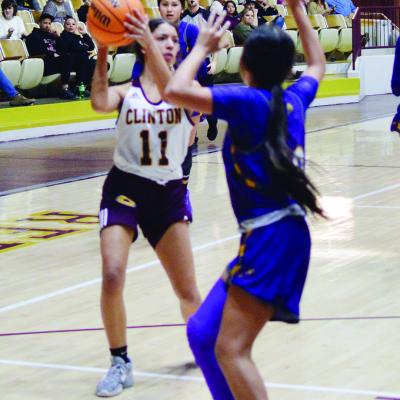 Clinton’s Rica Stennis looks for an opening to pass.