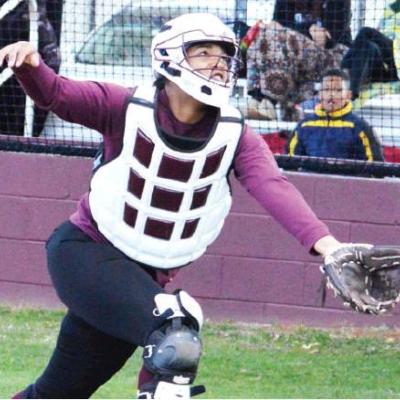 CDN | Collin Wieder Clinton senior slow-pitch softball catcher Nieva Whitney sprints to a foul ball and tries to catch it in a game against Thomas. Article Image Alt Text