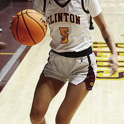 Clinton’s Lillian Lime dribbles the ball down the court during the Lady Reds’ recent home game against the Elk City Elkettes in the Tornado Dome. CDN | Sam Goodwyn Clinton’s Lillian Lime dribbles the ball down the court during the Lady Reds’ recent home game against the Elk City Elkettes in the Tornado Dome. CDN | Sam Goodwyn