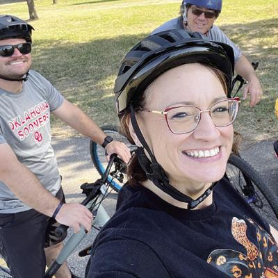 Clinton High School English teacher Letitia Arney takes a selfie with her son, Tyler, at left, and her husband, Bill, during a bike ride to help support the school’s Wellness Challenge. CDN | Courtesy photo