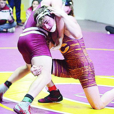 Clinton’s Landon Wilson, right, attempts a fireman’s carry of his opponent during the District Duals held at the Tornado Dome. CDN | Sam Goodwyn Clinton’s Landon Wilson, right, attempts a fireman’s carry of his opponent during the District Duals held at the Tornado Dome. CDN | Sam Goodwyn