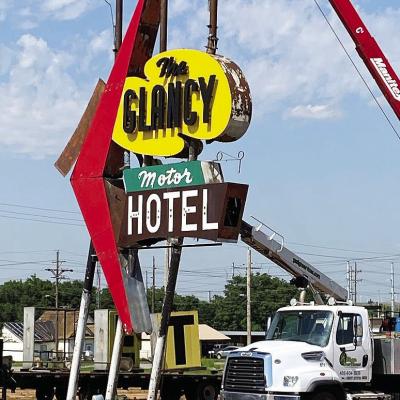 Crews worked Monday to remove the Glancy sign on Gary Boulevard. The sign will be refurbished and placed at the Oklahoma Rt. 66 Museum once the Oklahoma Highway Patrol Headquarters is torn down. CDN | Staff Photo