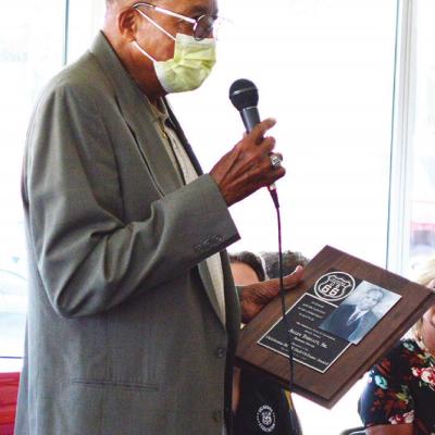 Allen Threatt III receives a plaque showing his late grandfather, Allen Threatt Sr., is now a member of the Oklahoma Route 66 Hall of Fame. Threatt Sr. was inducted posthumously Saturday at the Oklahoma Route 66 Museum in Clinton as a part of its Hall of Museum set to receive $1 million