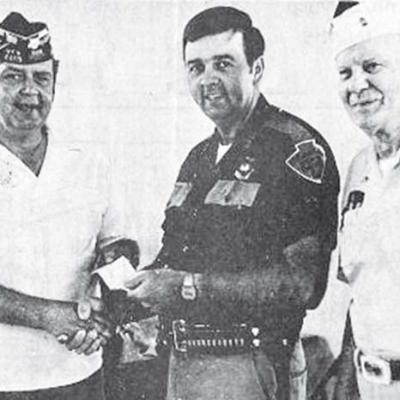 Trooper Dale Beaty, center, is congratulated by VFW members Chuck Rollins, left, and Troy Helm for being selected as the VFW Lawman of the Year. 40 YEARS AGO