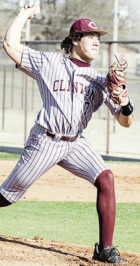 Clinton’s Easten Powell hurls the pitch during the Reds’ narrow win Friday at home over El Reno. CDN | Sam Goodwyn