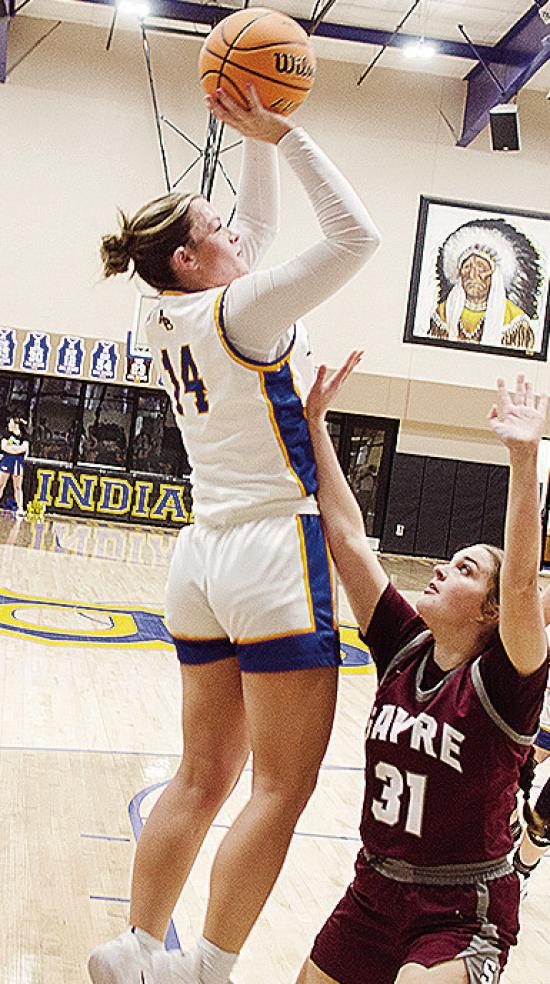 Arapaho-Butler’s Peyton Lambeth, left, shoots over the Sayre defender during the Lady Indians’ win over the Lady Eagles Thursday in the first round of the Western Equipment Classic. CDN | Sam Goodwyn